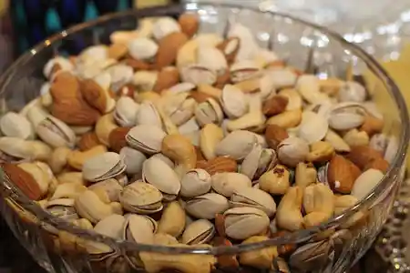 Mix dry fruits and nuts in glass bowl