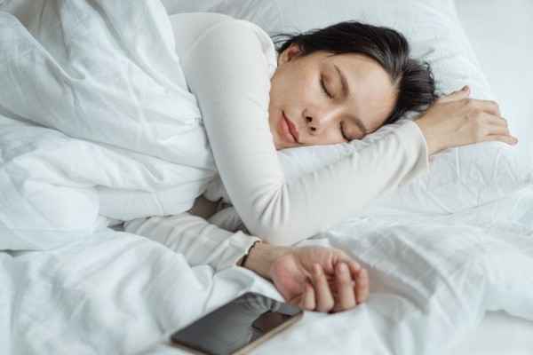 young-woman-sleeping-comfortably-in-bed