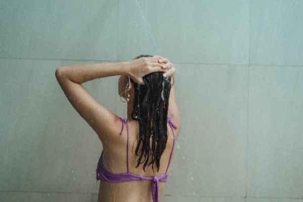 a-young-girl-taking-a-cold-shower