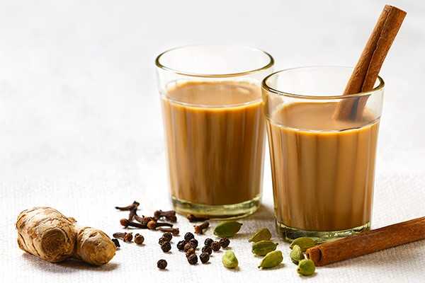  Indian Drink Masala Tea kept on White table with Spices
