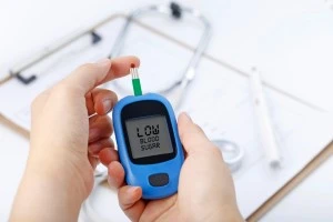 Type1 Diabetes A man check sugar level by glucometer
