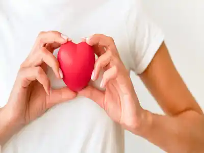 Woman holding heart shape