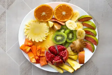 Mixed fruits served in white plate