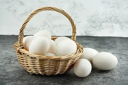 white-type chicken eggs in a wooden basket