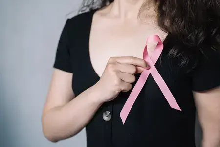 young-woman-showing-breast-cancer-symbol