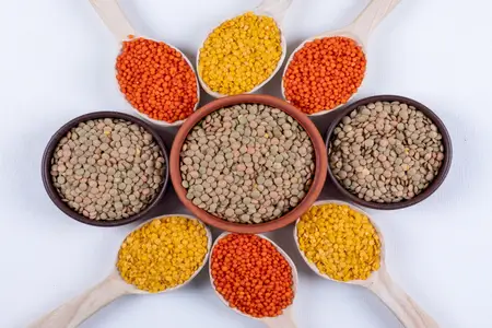 different-types-lentils-brown-bowls-wooden-spoons