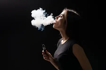 young-beautiful-woman-vaping-with-smoke
