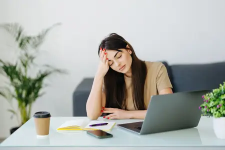 an-anxious-woman-sitting-at-her-work-place-in-the-office