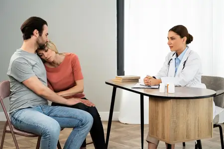 couple-talking-to-doctor-about-sti-treatment