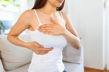 young-woman-checking-tumor-in-her-breast